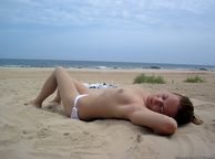 Girlfriend Laying Out Topless On Beach - dark hair lady topless
