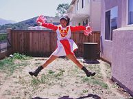 Asian Cheerleader Doing Her Cheers In The Backyard - far east