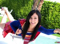Cosplay Cutie Doing Her Best Supergirl Pose - dark haired college coed clothed